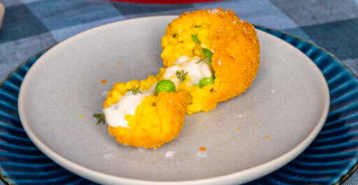Rice croquettes with herbs, peas and sweet Gorgonzola PDO
